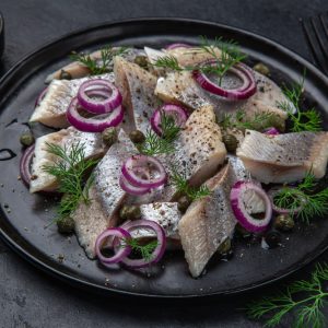 Pickled herring fish with spices