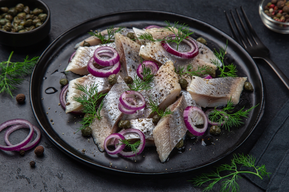 Pickled herring fish with spices